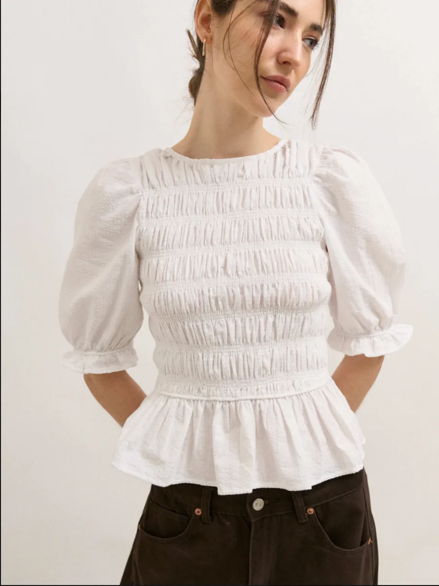 Blusa peplum con smock en cuerpo